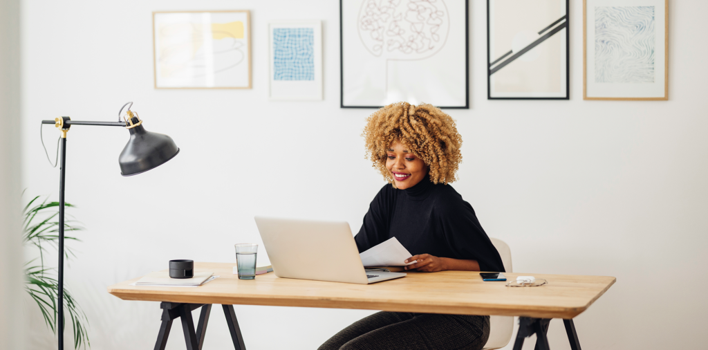 Woman working on a laptop computer at a desk