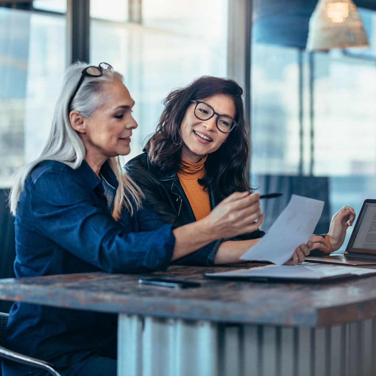Business professionals having a discussion at a table