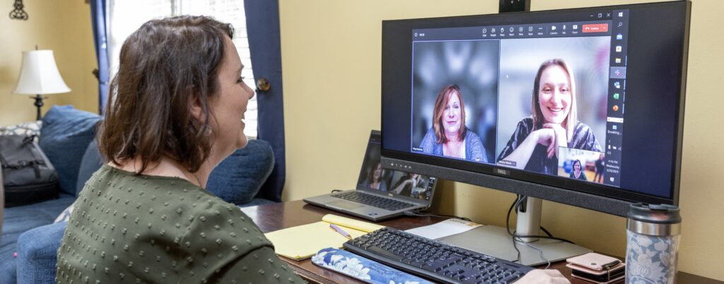 Woman video chatting on desktop computer