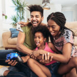 family placing video games together