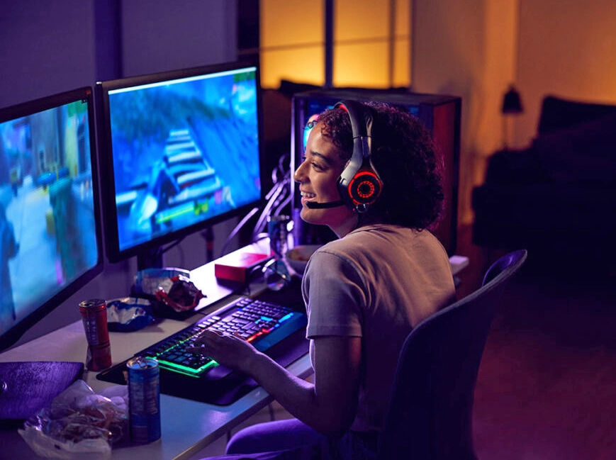 Young person playing video games on a computer