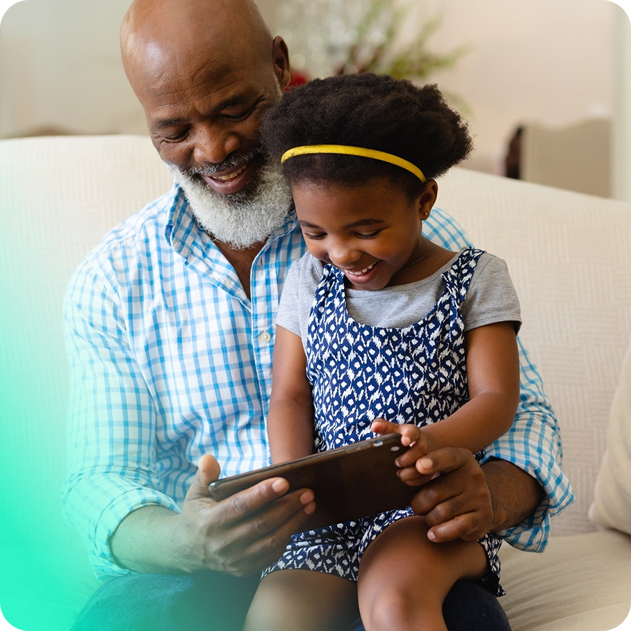 Father and daughter using tablet.