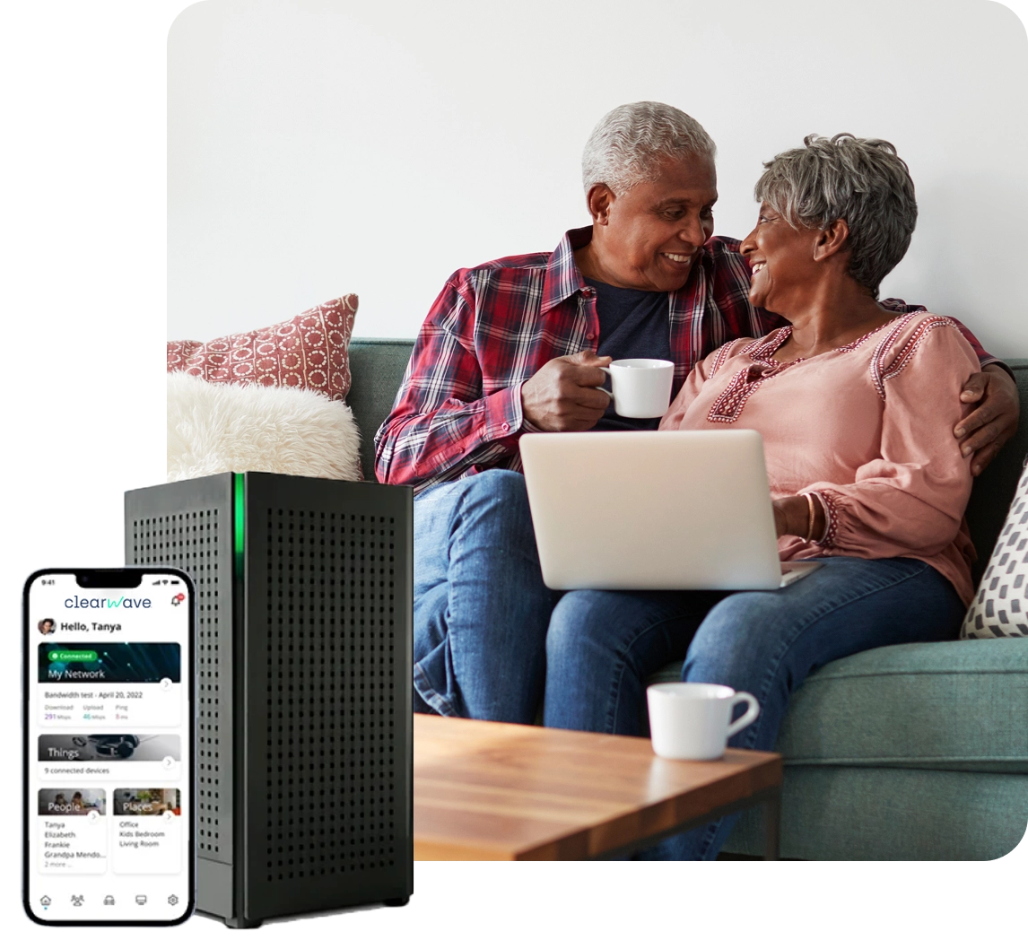 Internet router and couple using laptop.