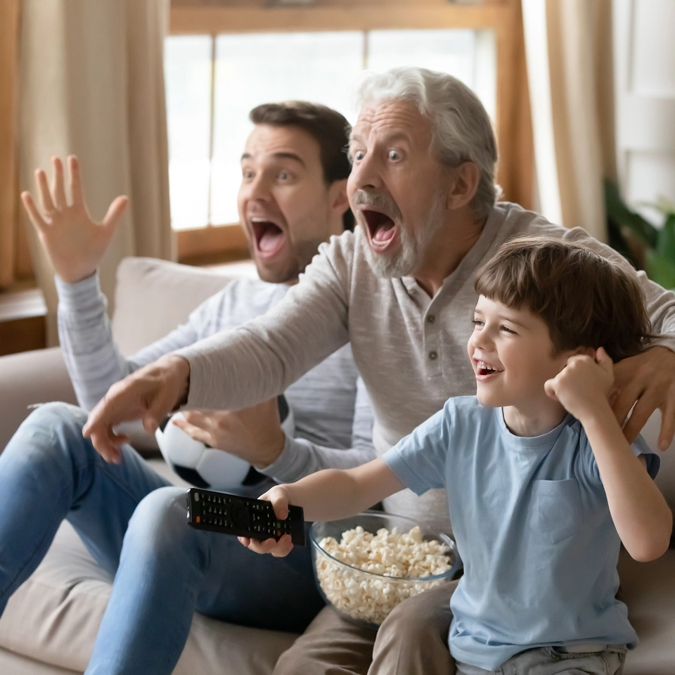 Family cheering at TV.